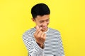 Happy young Asiam man doing finger heart, sign of love, symbol of love Royalty Free Stock Photo