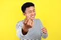 Happy young Asiam man doing finger heart, sign of love, symbol of love Royalty Free Stock Photo