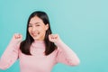 Happy young Asian beautiful woman smiling wear silicone orthodontic retainers on teeth surprised she is excited screaming and rais Royalty Free Stock Photo