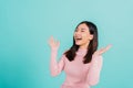 Asian beautiful woman smiling wear silicone orthodontic retainers on teeth surprised she is excited screaming and raise hand make Royalty Free Stock Photo