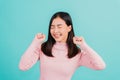 Happy young Asian beautiful woman smiling wear silicone orthodontic retainers on teeth surprised she is excited screaming and rais Royalty Free Stock Photo