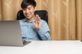 Happy young Asian Business man with long business shirt do online video conference for business meeting, working, live streaming Royalty Free Stock Photo