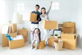 Happy young Asian family moves the boxes to a new home. Moving Concept Royalty Free Stock Photo