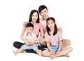 Happy young asian family sitting on floor Royalty Free Stock Photo