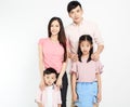 Happy young asian family standing before white background Royalty Free Stock Photo