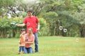 Asian family are blowing soap bubbles together. Royalty Free Stock Photo
