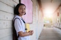 Happy young asian girl reading book at school Royalty Free Stock Photo