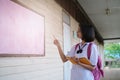 Happy young asian girl reading book at school Royalty Free Stock Photo