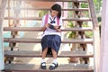 Happy young asian girl reading book at school Royalty Free Stock Photo