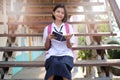 Happy young asian girl reading book at school Royalty Free Stock Photo