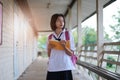 Happy young asian girl reading book at school Royalty Free Stock Photo