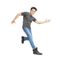 Happy young asian man dancing and jumping isolated on white Royalty Free Stock Photo