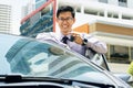 Happy Young Asian Man Smiling Showing Keys Of New Car Royalty Free Stock Photo