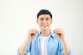 Happy Young Asian man smiling wearing glasses, isolated on white background Royalty Free Stock Photo