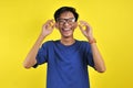 Happy Young Asian man smiling wearing glasses Royalty Free Stock Photo