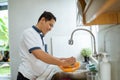 Man washing dishes Royalty Free Stock Photo