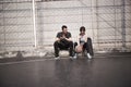 Happy young asian man and woman resting after exercise Royalty Free Stock Photo