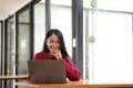 happy young asian pretty woman video call chat on digital laptop computer at caffee. Royalty Free Stock Photo