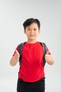 Happy young asian school boy with thumbs up isolated on a white background Royalty Free Stock Photo