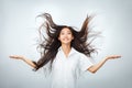 Happy young Asian woman with beautiful flying long hair Royalty Free Stock Photo