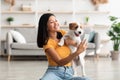 Happy asian woman taking selfie with her cute dog Royalty Free Stock Photo