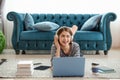 Happy young Asian woman listening to music with headphones relaxing at home Royalty Free Stock Photo