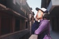 Happy young asian woman listening to music with headphones on the street. Royalty Free Stock Photo