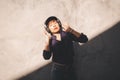 Happy young asian woman listening to music with headphones on the street. Royalty Free Stock Photo