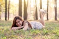 Happy young asian woman lying down on grass in the park Royalty Free Stock Photo