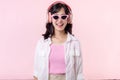 happy young asian woman model with stylish trendy sun glasses enjoy listening music by headphone audio and dancing isolated on