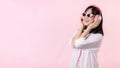 happy young asian woman model with stylish trendy sun glasses enjoy listening music by headphone audio and dancing isolated on