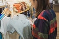 Happy young asian woman shopping trendy kid clothes for her`s son in shopping mall, Selective focus Royalty Free Stock Photo