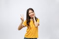 Happy young asian woman showing two fingers or victory gesture with blank copyspace area for text,Portrait of beautiful Royalty Free Stock Photo