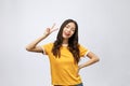 Happy young asian woman showing two fingers or victory gesture with blank copyspace area for text,Portrait of beautiful Royalty Free Stock Photo