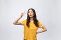 Happy young asian woman showing two fingers or victory gesture with blank copyspace area for text,Portrait of beautiful Royalty Free Stock Photo