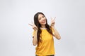 Happy young asian woman showing two fingers or victory gesture with blank copyspace area for text,Portrait of beautiful Royalty Free Stock Photo