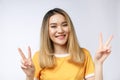 Happy young asian woman showing two fingers or victory gesture with blank copyspace area for text,Portrait of beautiful Royalty Free Stock Photo