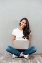 Happy young asian woman working on laptop computer Royalty Free Stock Photo