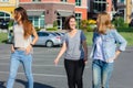 Happy young Asian women group city lifestyle playing and chatting each other among the pastel building city on weekend. Royalty Free Stock Photo