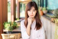 Happy young attractive asian business woman smiling at camera, standing at outdoor patio of her office Royalty Free Stock Photo