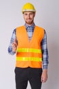 Happy young bearded man construction worker giving handshake Royalty Free Stock Photo