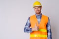 Happy young bearded man construction worker giving thumbs up Royalty Free Stock Photo