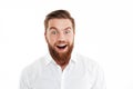 Happy young bearded man standing over white wall Royalty Free Stock Photo