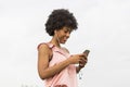 Happy young beautiful afro american woman listening to music in Royalty Free Stock Photo