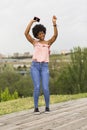 Happy young beautiful afro american woman listening to music in Royalty Free Stock Photo