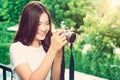 Happy young beautiful asian woman smiling and taking picture wit