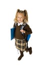 Happy young beautiful blond schoolgirl with pigtails and school uniform carrying backpack