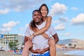 Happy young beautiful couple having fun on the beach. Royalty Free Stock Photo