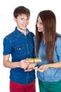 Happy Young beautiful Couple isolated on a White background with gift in hand Royalty Free Stock Photo