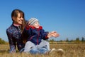 Happy young beautiful mather with baby on nature outdoor